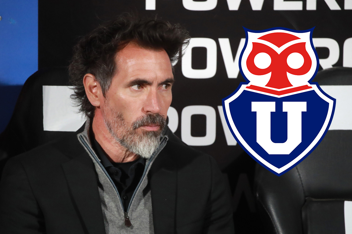 Primer plano de Eduardo Domínguez junto al escudo de Universidad de Chile.